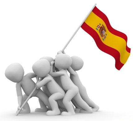 Personas clavando la bandera de España